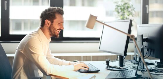 Person typing in computer